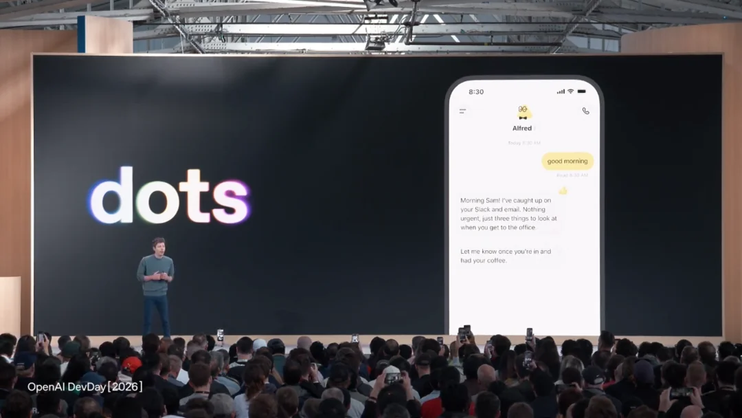 Sam Altman presenting OpenAI Dots at DevDay 2026, with a phone showing a Dot named Alfred summarizing Slack and email